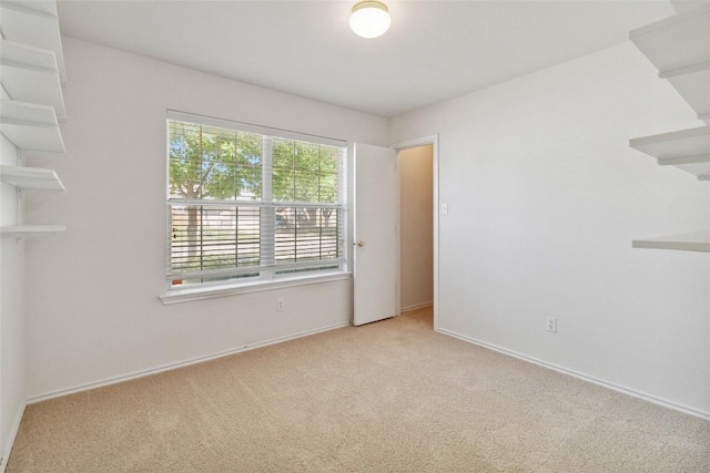 223 Sylvan St, Hutto, TX 78634 - spare room featuring baseboards and carpet flooring