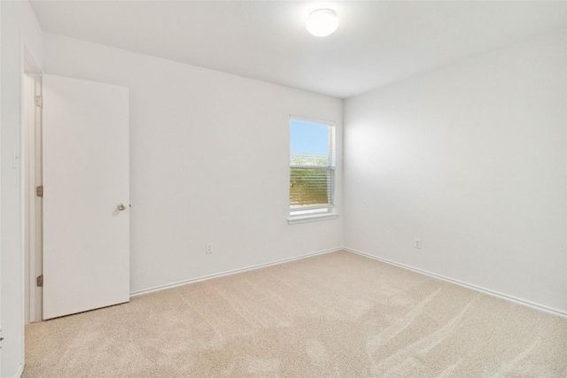 223 Sylvan St, Hutto, TX 78634 - carpeted empty room with baseboards