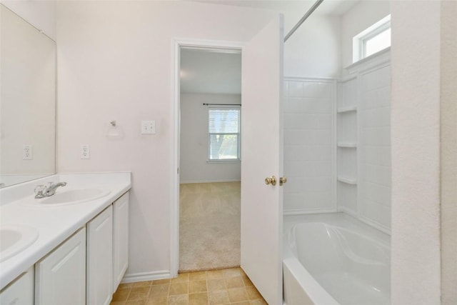 223 Sylvan St, Hutto, TX 78634 - full bathroom with a sink, double vanity, and a healthy amount of sunlight