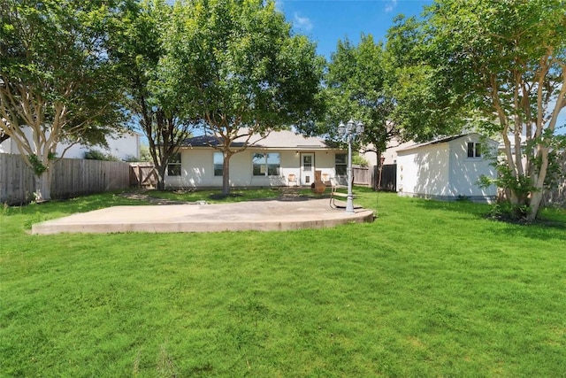223 Sylvan St, Hutto, TX 78634 - view of yard featuring a fenced backyard and a patio
