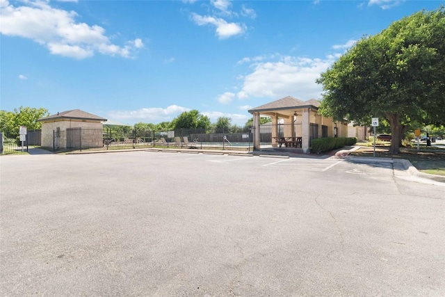 223 Sylvan St, Hutto, TX 78634 - uncovered parking lot featuring fence