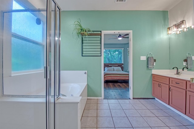 bathroom featuring a bath, tile patterned flooring, a stall shower, and ceiling fan