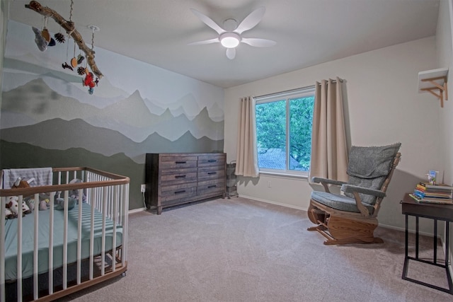 carpeted bedroom featuring baseboards and a ceiling fan