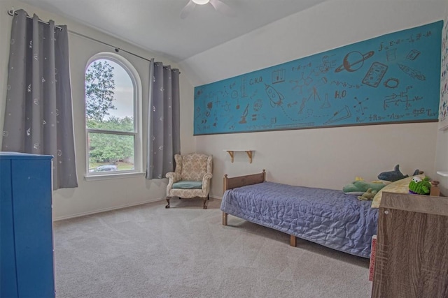bedroom with lofted ceiling, carpet floors, a ceiling fan, and baseboards