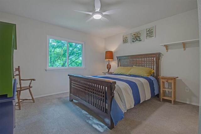 carpeted bedroom with baseboards and ceiling fan