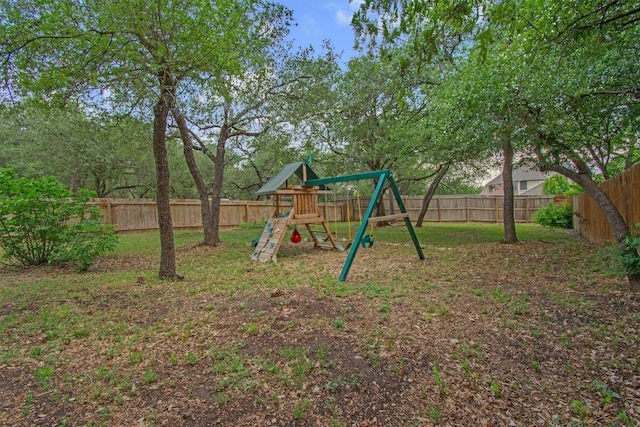 view of play area featuring a yard and a fenced backyard