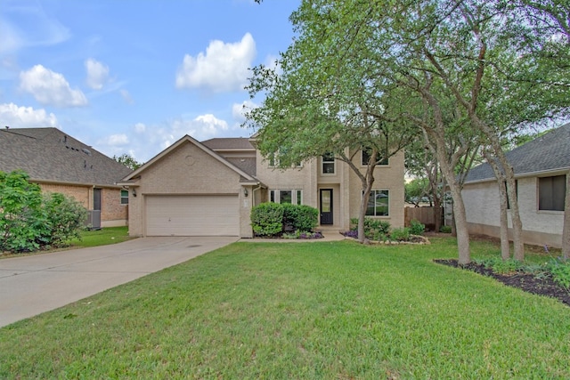view of front facade featuring an attached garage, driveway, and a front yard