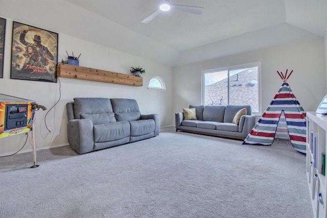 carpeted living room featuring lofted ceiling, a ceiling fan, and baseboards