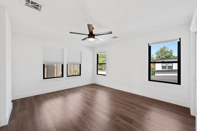 7008 Meador Ave Unit 1, Austin, TX 78752 - spare room with ceiling fan, baseboards, dark wood-style flooring, and visible vents