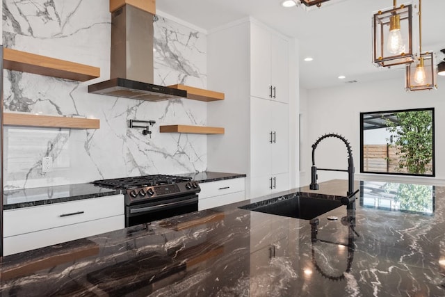 7008 Meador Ave Unit 1, Austin, TX 78752 - kitchen with open shelves, black range with gas cooktop, wall chimney exhaust hood, a sink, and decorative backsplash