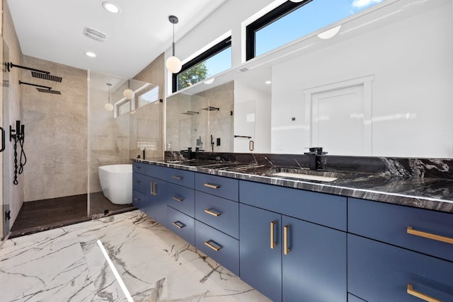 7008 Meador Ave Unit 1, Austin, TX 78752 - full bathroom featuring recessed lighting, marble finish floor, a freestanding bath, vanity, and tiled shower