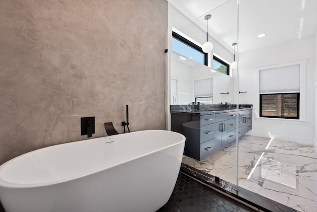 7008 Meador Ave Unit 1, Austin, TX 78752 - full bathroom featuring recessed lighting, marble finish floor, double vanity, a sink, and a soaking tub