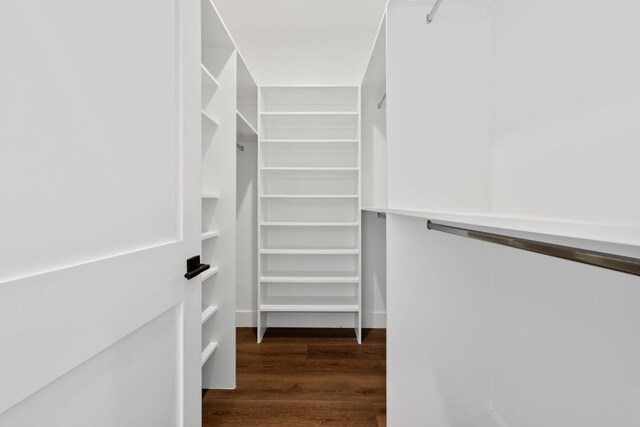 7008 Meador Ave Unit 1, Austin, TX 78752 - walk in closet featuring wood finished floors