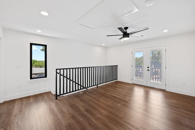 7008 Meador Ave Unit 1, Austin, TX 78752 - unfurnished room featuring attic access, wood finished floors, recessed lighting, and a healthy amount of sunlight
