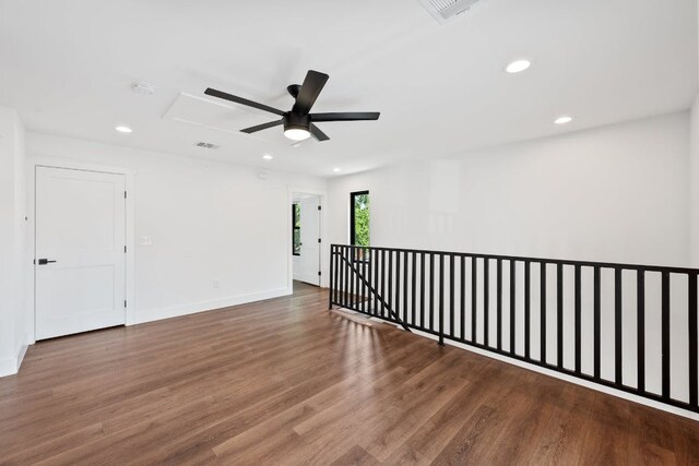 7008 Meador Ave Unit 1, Austin, TX 78752 - spare room with attic access, a ceiling fan, wood finished floors, recessed lighting, and baseboards