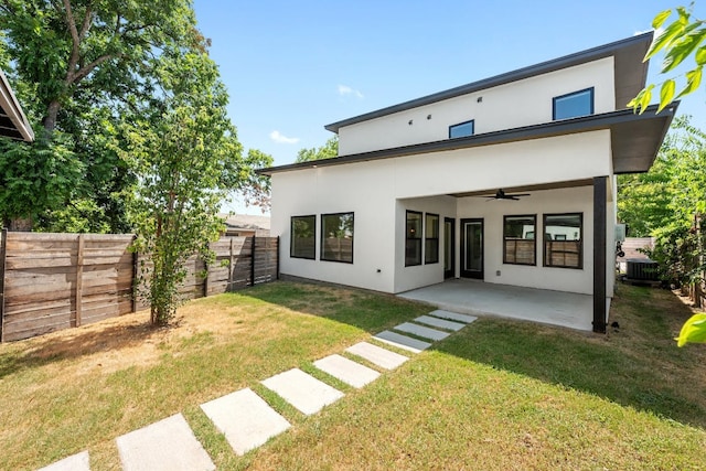 7008 Meador Ave Unit 1, Austin, TX 78752 - rear view of house featuring ceiling fan, stucco siding, a patio area, and central AC unit