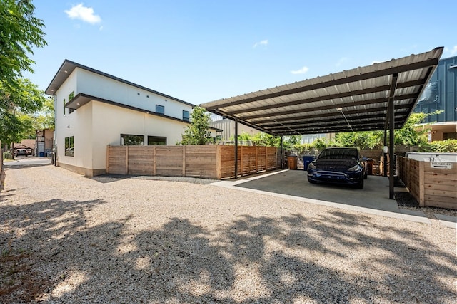 7008 Meador Ave Unit 1, Austin, TX 78752 - view of car parking with a detached carport, fence, and driveway