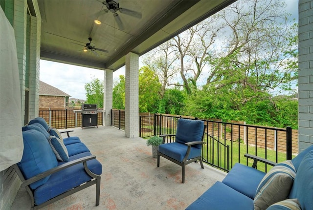 view of patio featuring area for grilling and a ceiling fan