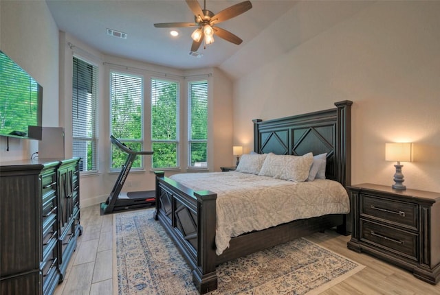 bedroom featuring visible vents, a ceiling fan, light wood-type flooring, and multiple windows