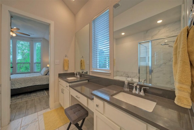 ensuite bathroom with ensuite bath, plenty of natural light, a marble finish shower, and a sink