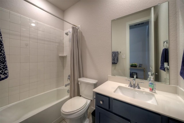 full bath featuring toilet, vanity, a textured wall, and shower / tub combo with curtain