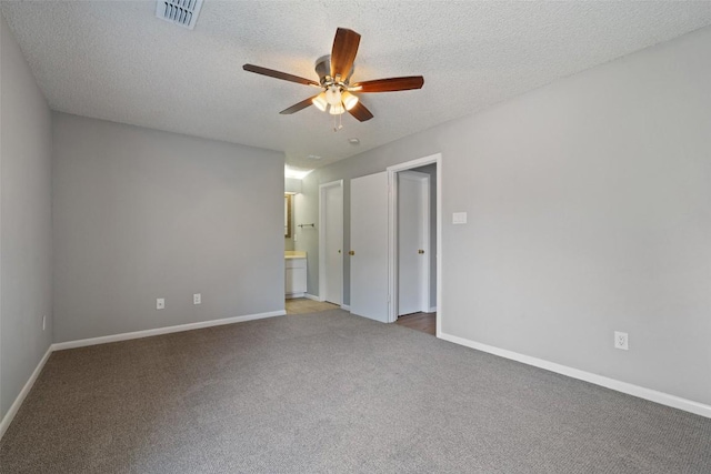 spare room with visible vents, ceiling fan, baseboards, and carpet floors