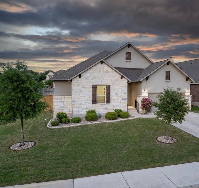 1801 Lakeside Ranch Rd, Georgetown, TX 78633 - view of front of house with stucco siding, a standing seam roof, driveway, stone siding, and metal roof