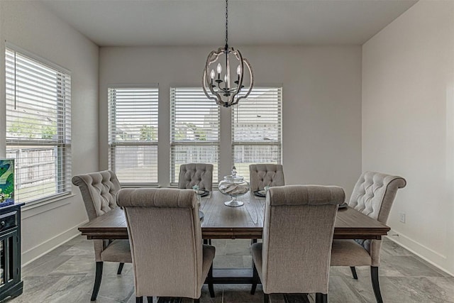 1801 Lakeside Ranch Rd, Georgetown, TX 78633 - dining room with a chandelier, baseboards, and light stone finish flooring