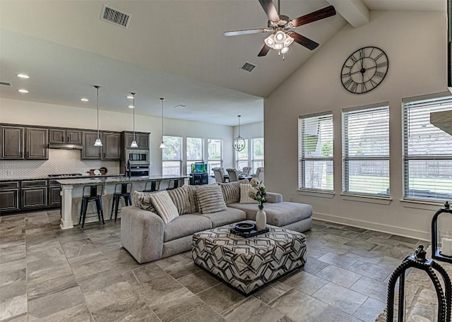 1801 Lakeside Ranch Rd, Georgetown, TX 78633 - living room featuring recessed lighting, beamed ceiling, ceiling fan, high vaulted ceiling, and stone tile floors
