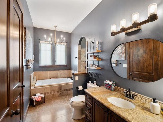 2749 Springwood Ln, Georgetown, TX 78628 - full bathroom featuring lofted ceiling, a bath, toilet, vanity, and a chandelier
