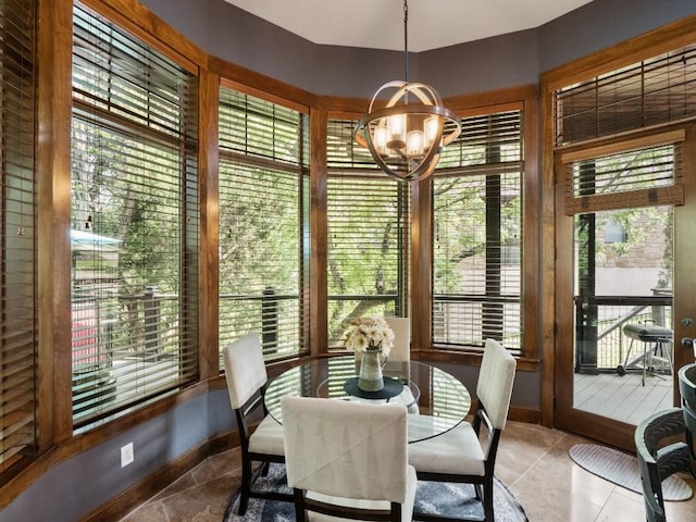 2749 Springwood Ln, Georgetown, TX 78628 - tiled dining space with a chandelier, healthy amount of natural light, and baseboards
