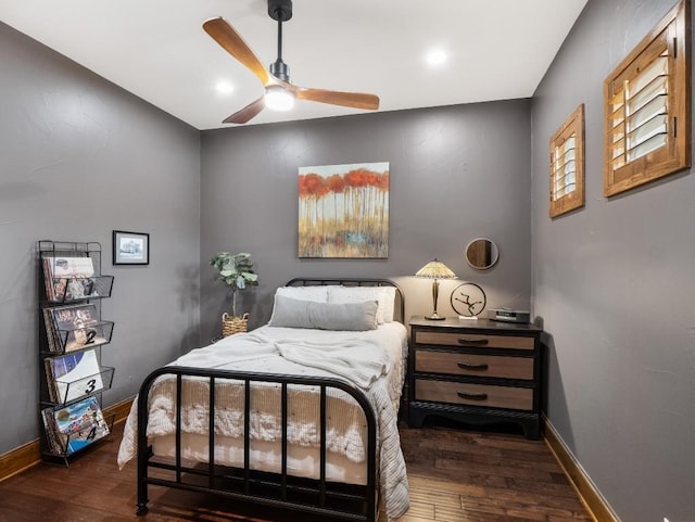 bedroom with baseboards, wood finished floors, and a ceiling fan