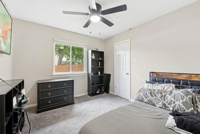bedroom with carpet flooring, ceiling fan, and baseboards