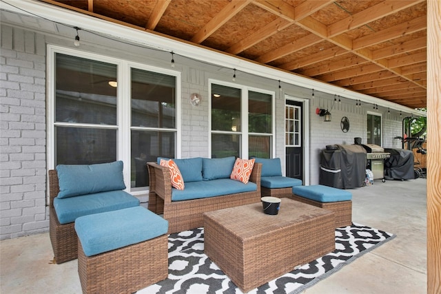 view of patio / terrace featuring an outdoor hangout area and a grill