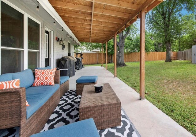 view of patio featuring an outdoor living space and a fenced backyard