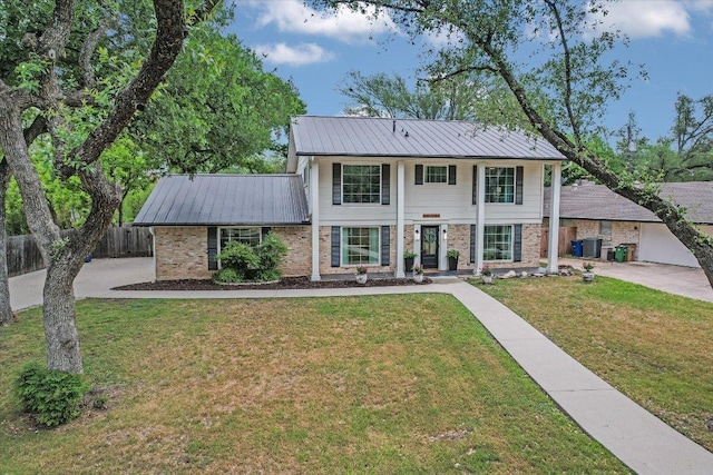 view of front of house featuring central air condition unit, brick siding, metal roof, and fence