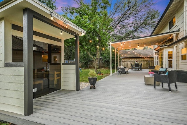 deck at dusk with fence