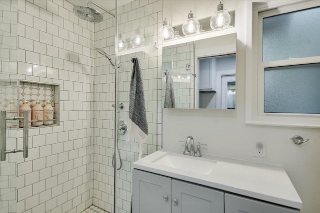 full bathroom featuring a stall shower and vanity