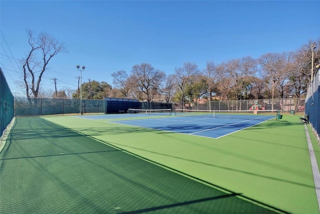 view of sport court featuring fence and community basketball court