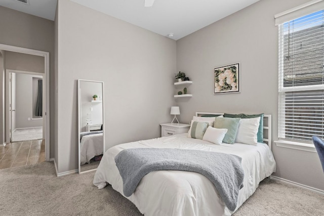 330 Conestoga Dr, Kyle, TX 78640 - bedroom with light carpet and ceiling fan