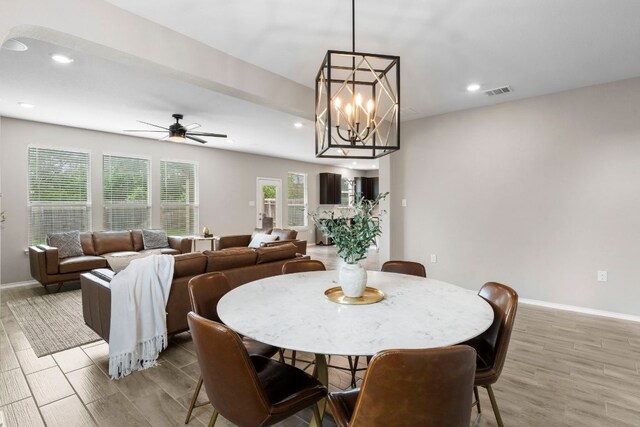 330 Conestoga Dr, Kyle, TX 78640 - dining room with recessed lighting, a ceiling fan, wood finished floors, and a chandelier