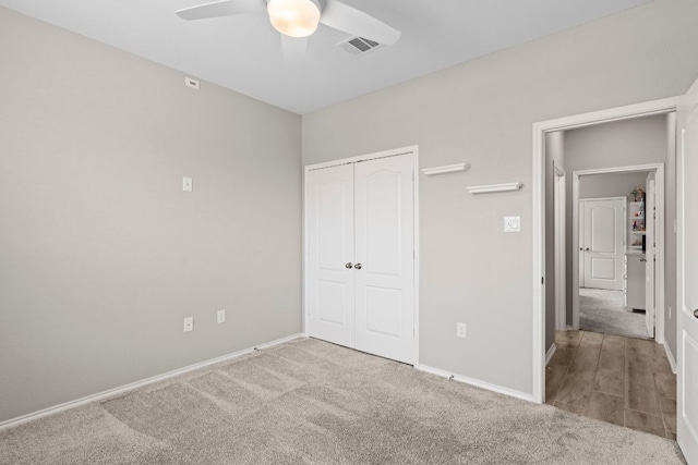 330 Conestoga Dr, Kyle, TX 78640 - unfurnished bedroom with carpet, a closet, and ceiling fan