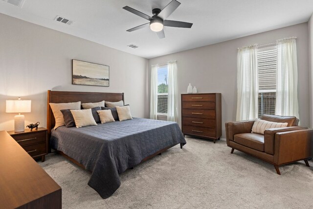 330 Conestoga Dr, Kyle, TX 78640 - bedroom featuring light colored carpet and ceiling fan