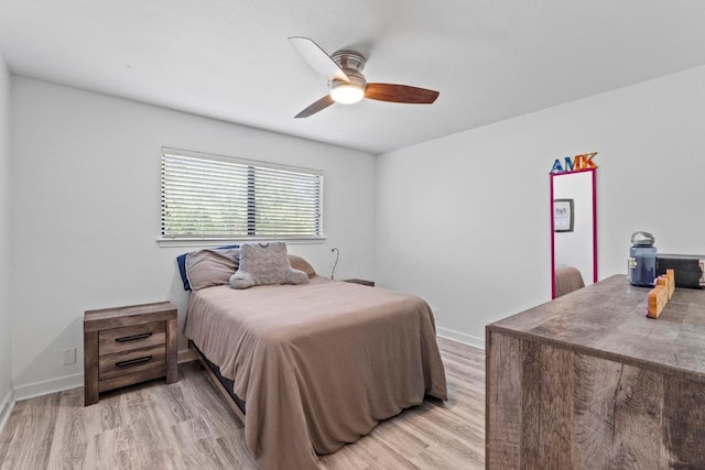 508 Explorer, Lakeway, TX 78734 - bedroom with light wood-style floors and ceiling fan