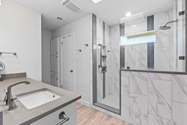 508 Explorer, Lakeway, TX 78734 - bathroom with vanity, walk in shower, and wood finished floors