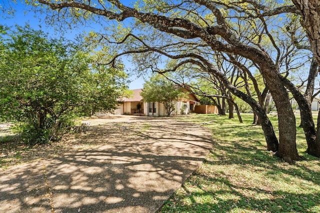 508 Explorer, Lakeway, TX 78734 - view of property hidden behind natural elements with driveway