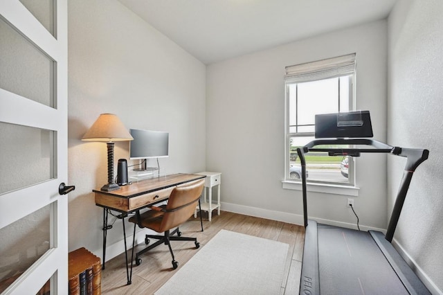office area featuring wood finished floors and baseboards