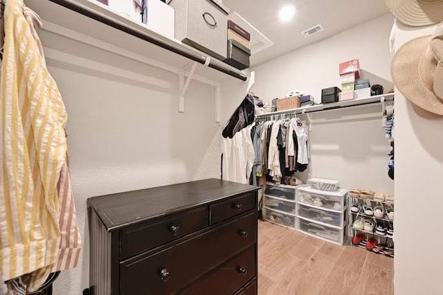 walk in closet featuring visible vents and light wood finished floors