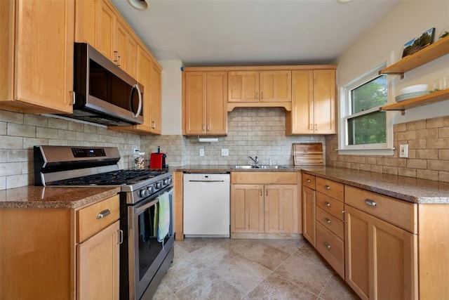 kitchen featuring open shelves, decorative backsplash, a sink, stainless steel appliances, and light brown cabinetry
