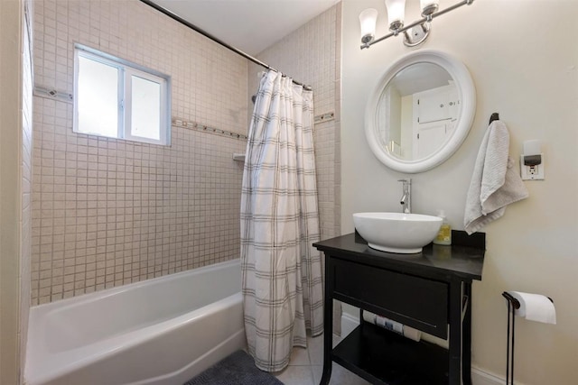 bathroom featuring shower / bath combo with shower curtain and vanity